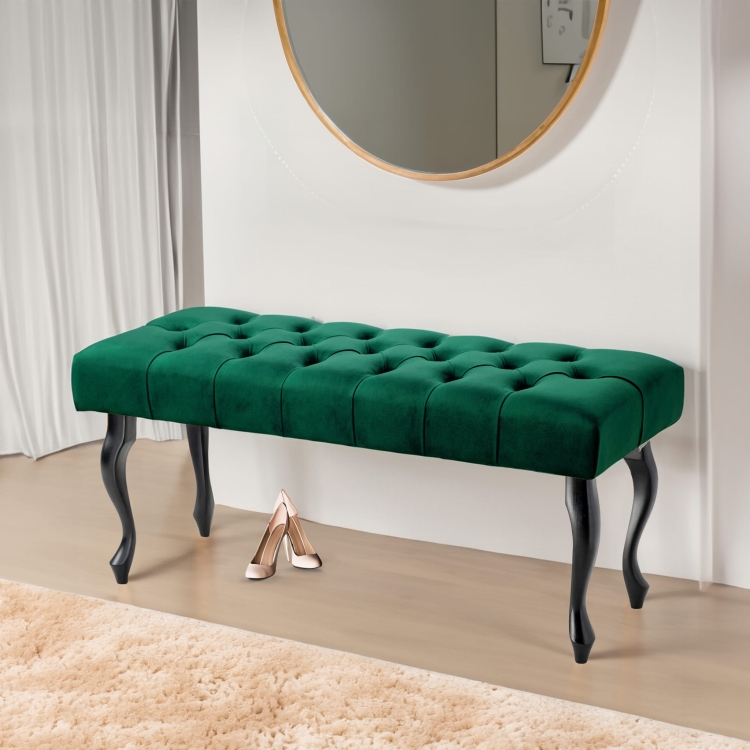 Gewatteerde bank in flessengroene tint met zwarte poten