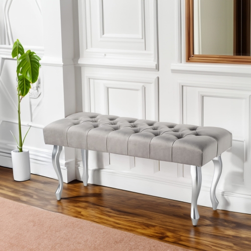 Gequilte bank voor de gang